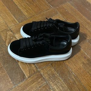 Alexander McQueen black suede with white bottom sneakers